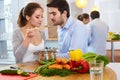 Young ÃÂ¡ouple ÃÂ¡ooking in Ãâ¢he Kitchen. Healthy food